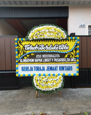 Papan Bunga Duka di Doyado